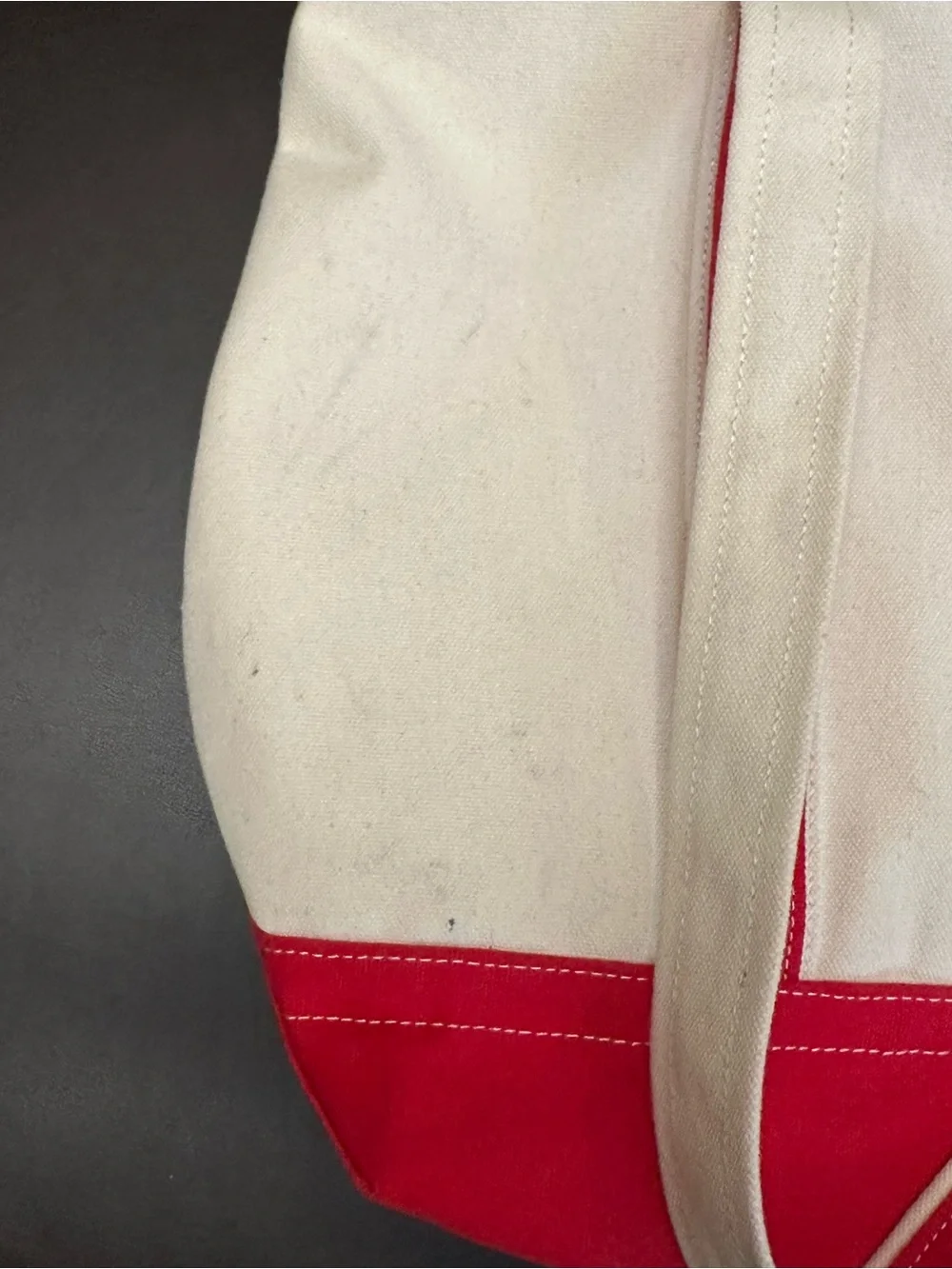 Cream Canvas Tote with Red Trim and Decorative Charm